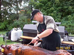 Terence begins to cut a pig